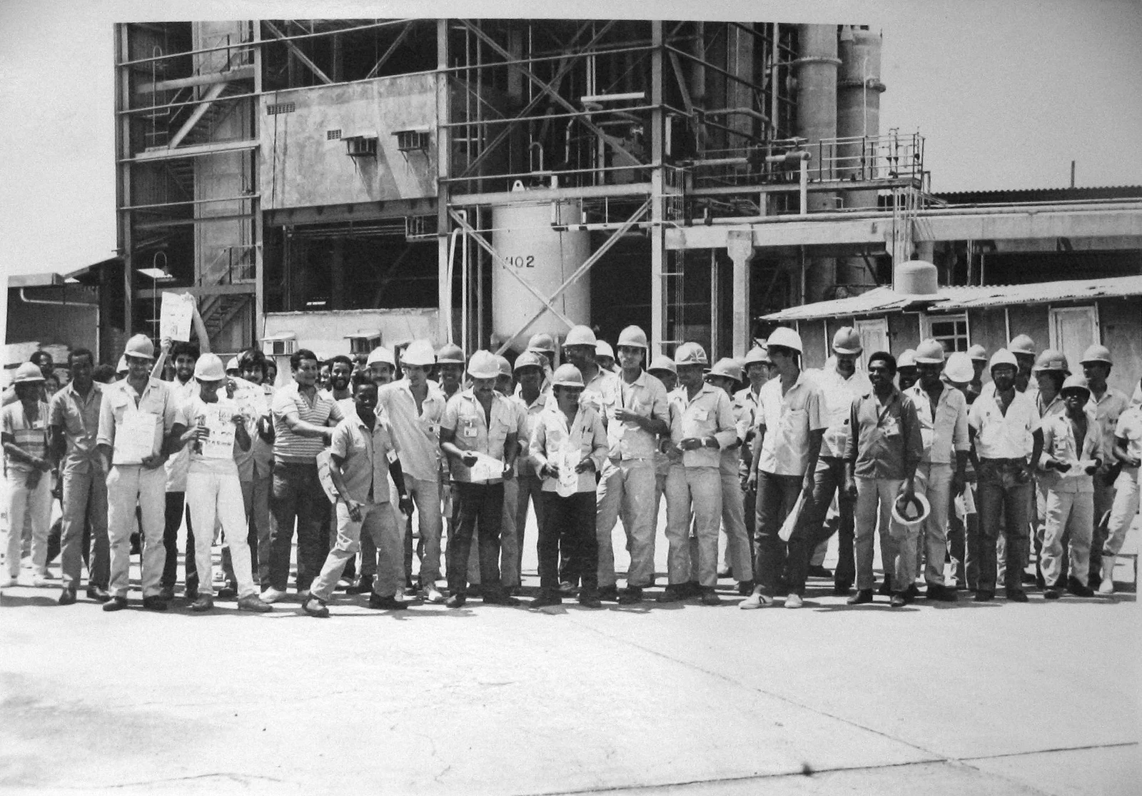 Workers at the petrochemical complex posing for a photo